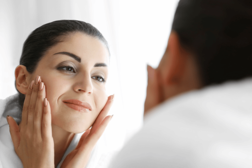 Female in mirror with great skin care health