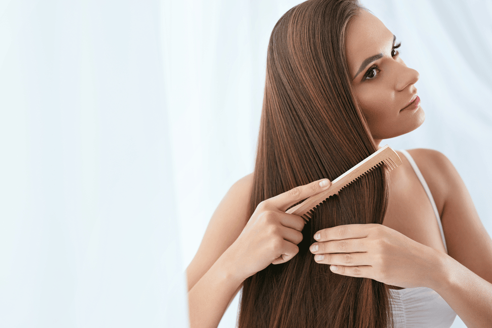 Woman coming long and full thick hair